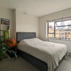 Photo 2: The large window fills the room with natural light even on a gloomy day