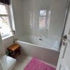 Photo 7: The shared bathroom - bath with shower over