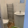 Photo 6: Shower with sink, toilet
