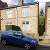Photo 9: Front of house with garden to rear