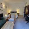 Photo 3: Wide Angle Lens of full room with wardrobe 