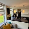 Photo 5: well-equipped shared kitchen with dishwasher, washing machine and ample storage.
