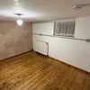 Photo 3: empty room (at night), feat. window and radiator