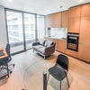Photo 2: Lounge, kitchen and balcony area