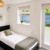 Photo 2: Sleeping area and garden doors