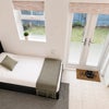 Photo 7: Studio / kitchen / sleeping area
