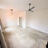 Photo 4: living room/3rd bedroom
