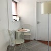 Photo 8: Quiet hallway seating area, providing a calm alternative spot to sit and eat.