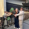Photo 3: Us at a Giraffe Close Encounter at Wellington Zoo in our few days in NZ!