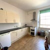 Photo 2: Downstairs Kitchen
