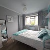 Photo 2: Furnished double bedroom with storage