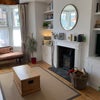 Photo 2: Living room with TV