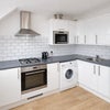 Photo 5: Kitchen shared with two other people 