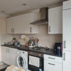 Photo 3: Kitchen with oven + fridge and washing machine