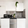 Photo 3: Fridge freezer, toaster, kettle, microwave.