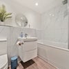 Photo 7: Main bathroom with bath and overhead shower