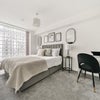 Photo 2: King bedroom with smart TV and dedicated workspace