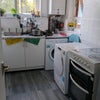 Photo 5: Sheared kitchen space, big drawers, dryer, etc