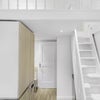 Photo 3: Fridge and microwave under the stairs.
