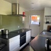 Photo 5: Kitchen with induction hob, fridge, freezer, dishwasher, washing machine and tumble dryer