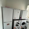 Photo 9: Fridge/washing room