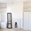 Photo 2: Storage and mirror