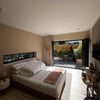 Photo 5: King size bed and bifold doors
