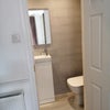 Photo 5: Bedroom 3 WC, vanity, door and storage areas