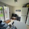 Photo 11: Communal Sofa and TV