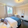 Photo 3: Lots of light and blackout curtains