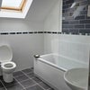 Photo 4: Brand new shower, bath and tiling Sept 2026