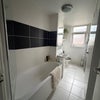 Photo 4: Bathroom with shower.