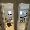 Photo 7: Two clean and modern shared shower rooms