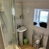 Photo 8:  clean and modern shared shower rooms