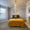 Photo 7: Double bedroom with bay window and fireplace