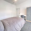 Photo 2: Double bedroom with desk and wardrobe