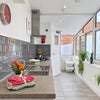 Photo 8: Communal Kitchen and Living Area