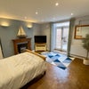 Photo 2: Bright & Spacious Main Living Area with French Doors