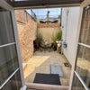 Photo 7: Private Courtyard Garden Accessed via French Doors