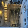 Photo 9: Atmospheric Evening Courtyard with Feature Lighting