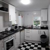 Photo 9: One of Two Communal Kitchens