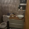 Photo 6: The Bathroom ( with a bath shower)