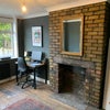 Photo 7: More up to date image of the decor of how the walls of the room look like.