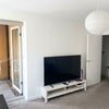 Photo 5: Living Room with TV and console