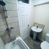 Photo 9: Bathroom with shower over bath