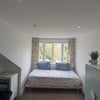 Photo 3: Room 1 (Second Floor): Bed + Wardrobe