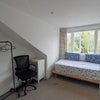 Photo 1: Room 1 (Second Floor): Bed + Wardrobe