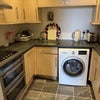 Photo 5: Kitchen with washer/dryer