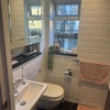 Photo 8: Shared bathroom with cabinet storage