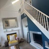 Photo 4: Stairs in living room leading up to available room. 